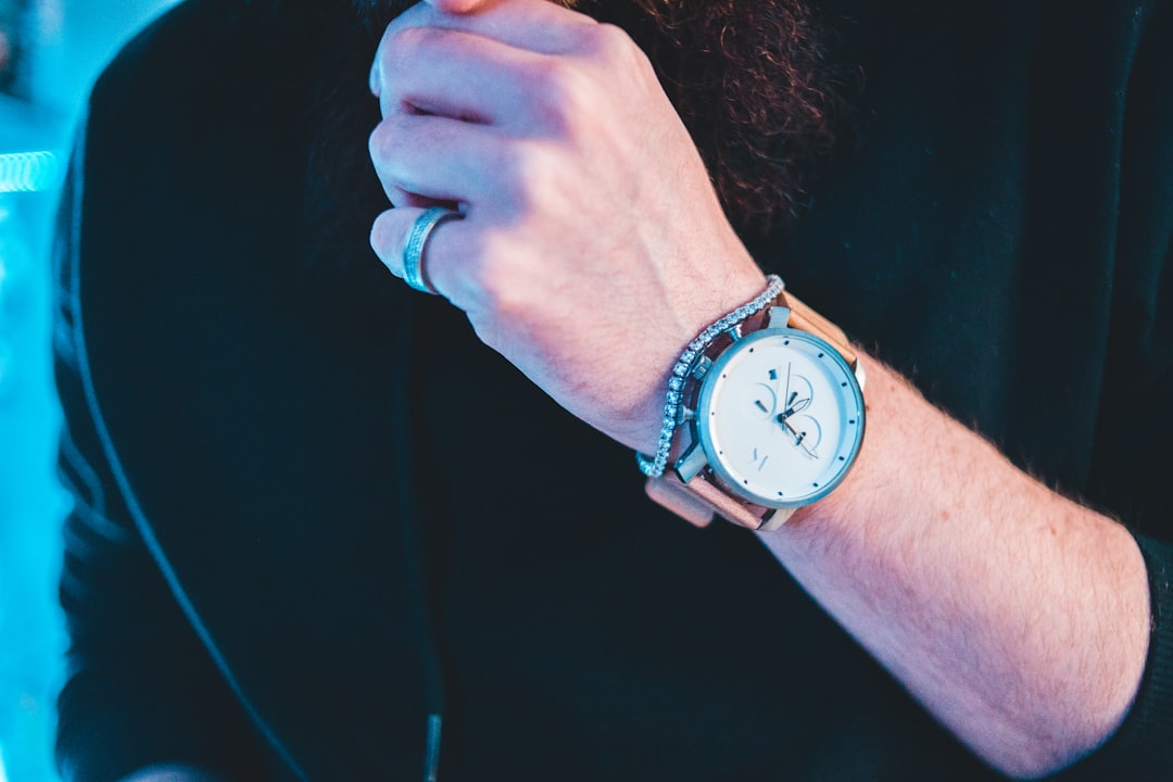 round white and silver-colored chronograph watch with pink leather band