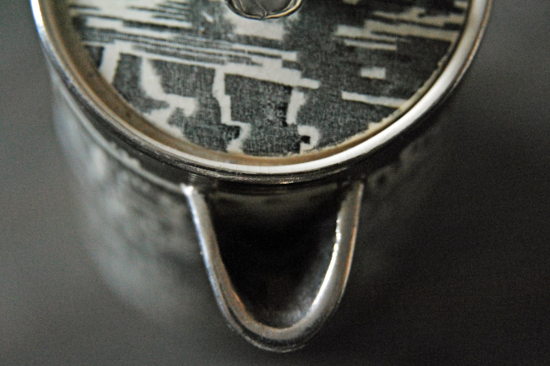 silver and black round analog watch