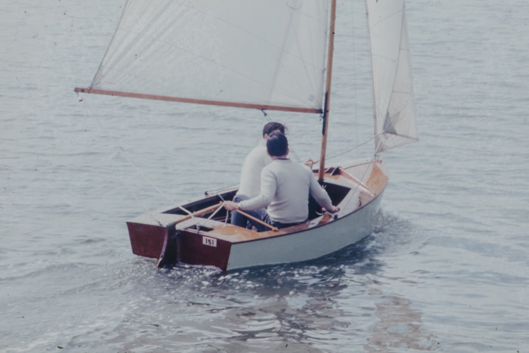 two person sitting in boat during daytime