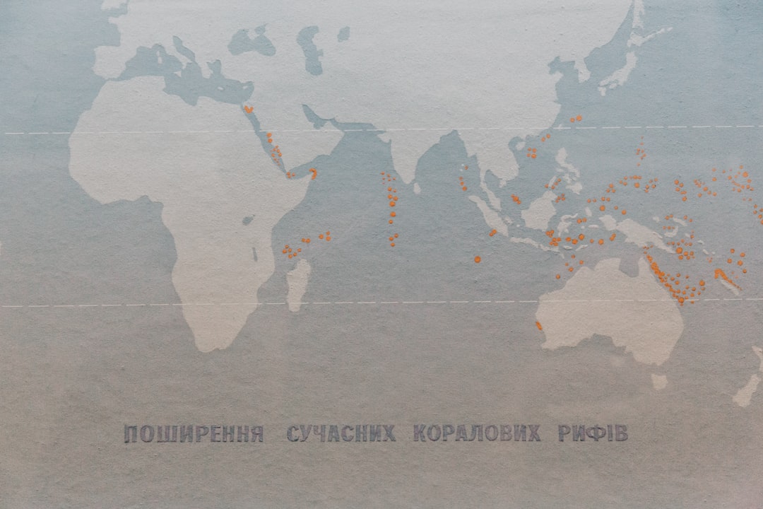 a map of the world with orange dots