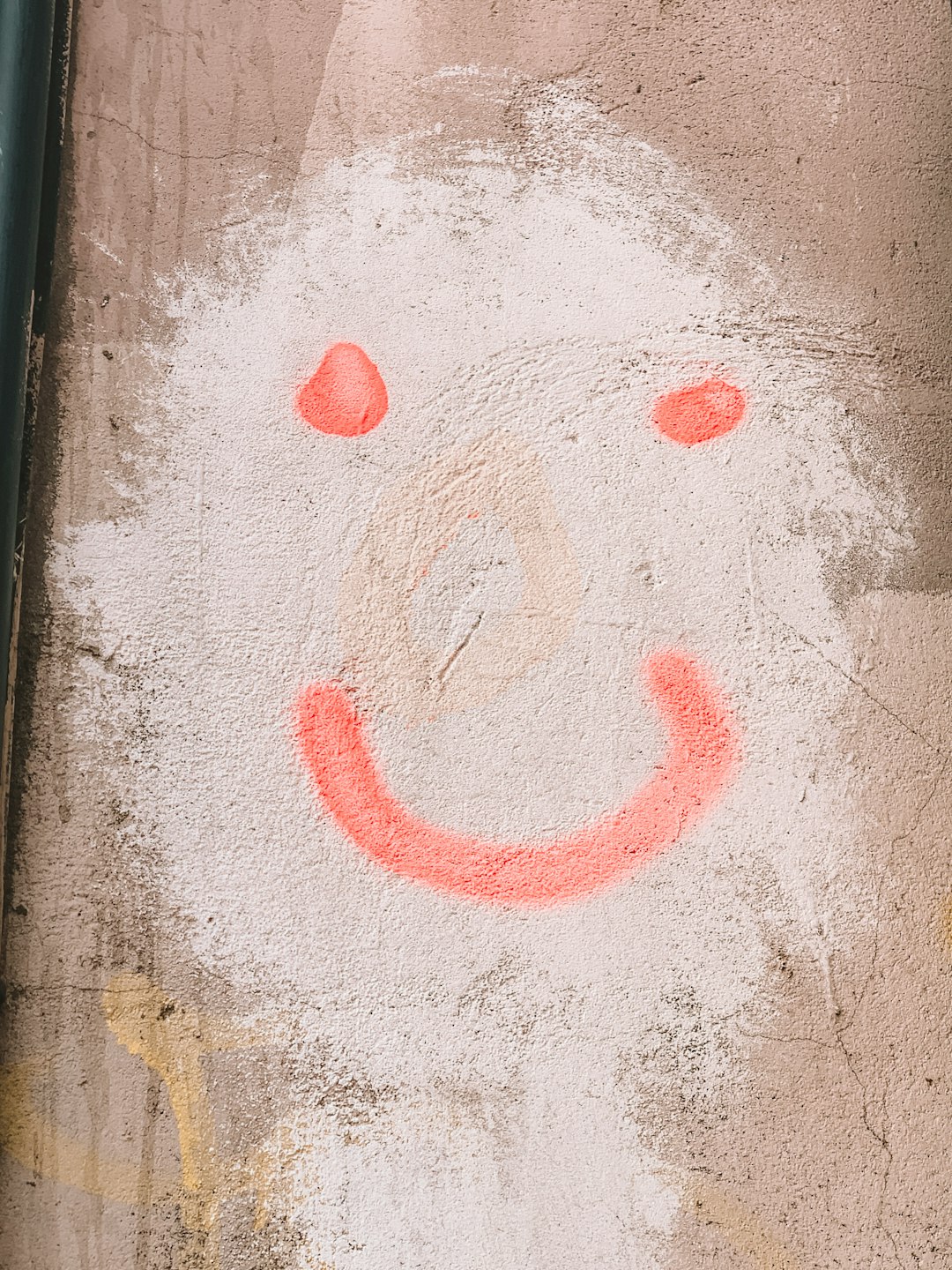 smiley artwork on wall