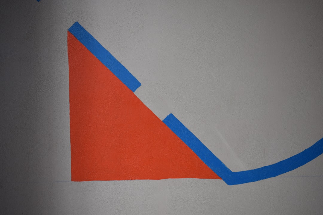 a drawing of a triangle on a white wall