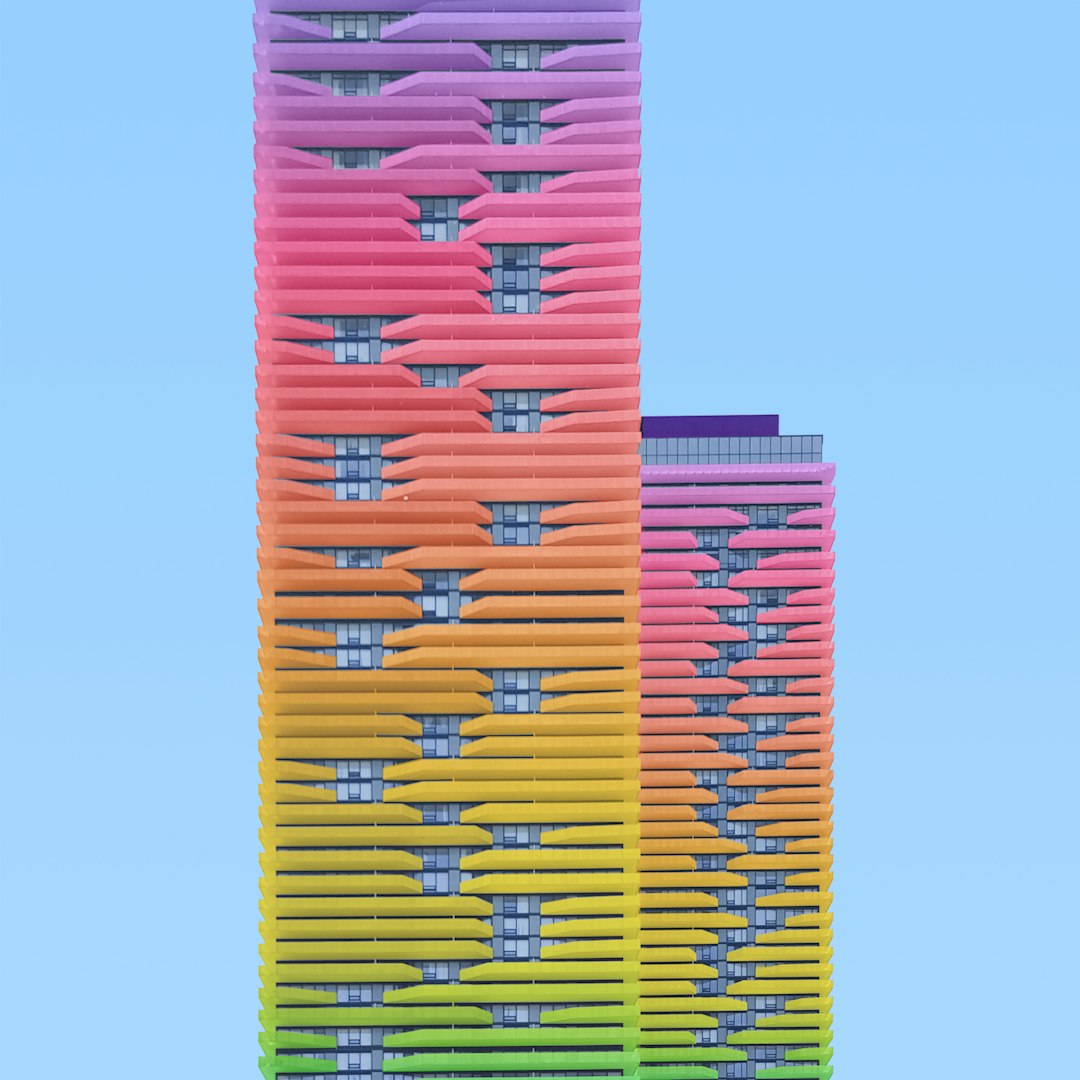 a multicolored building is shown against a blue sky