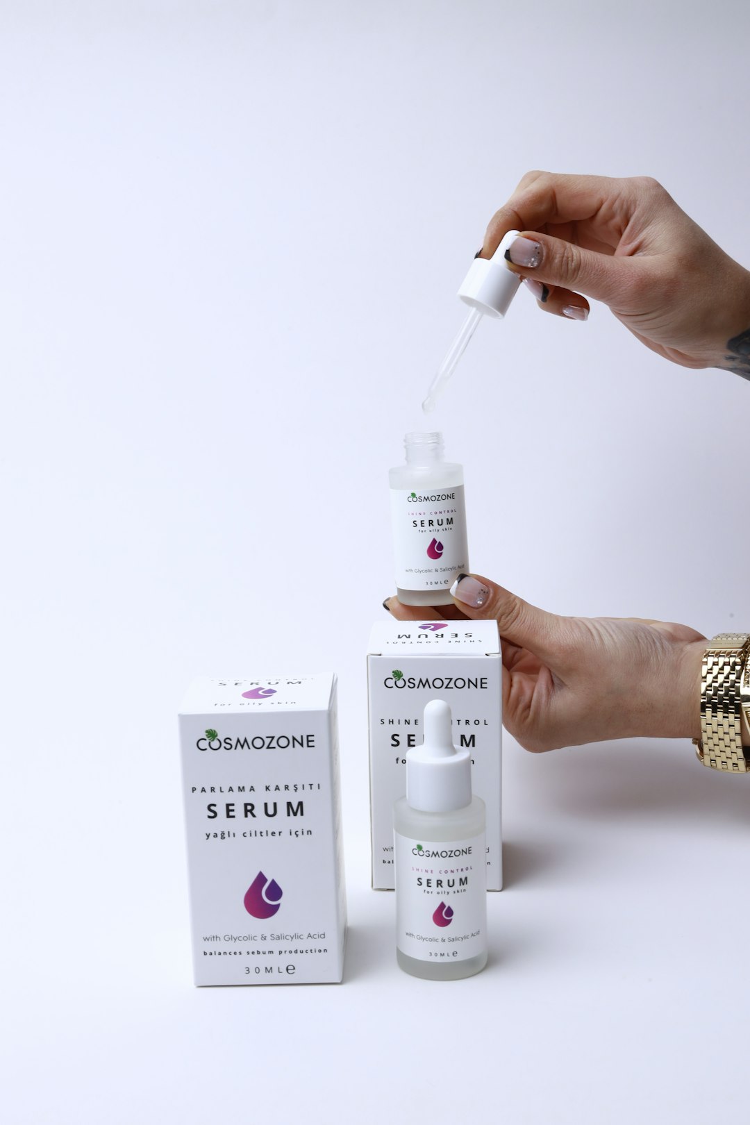 a person holding a syringe and a bottle of medicine