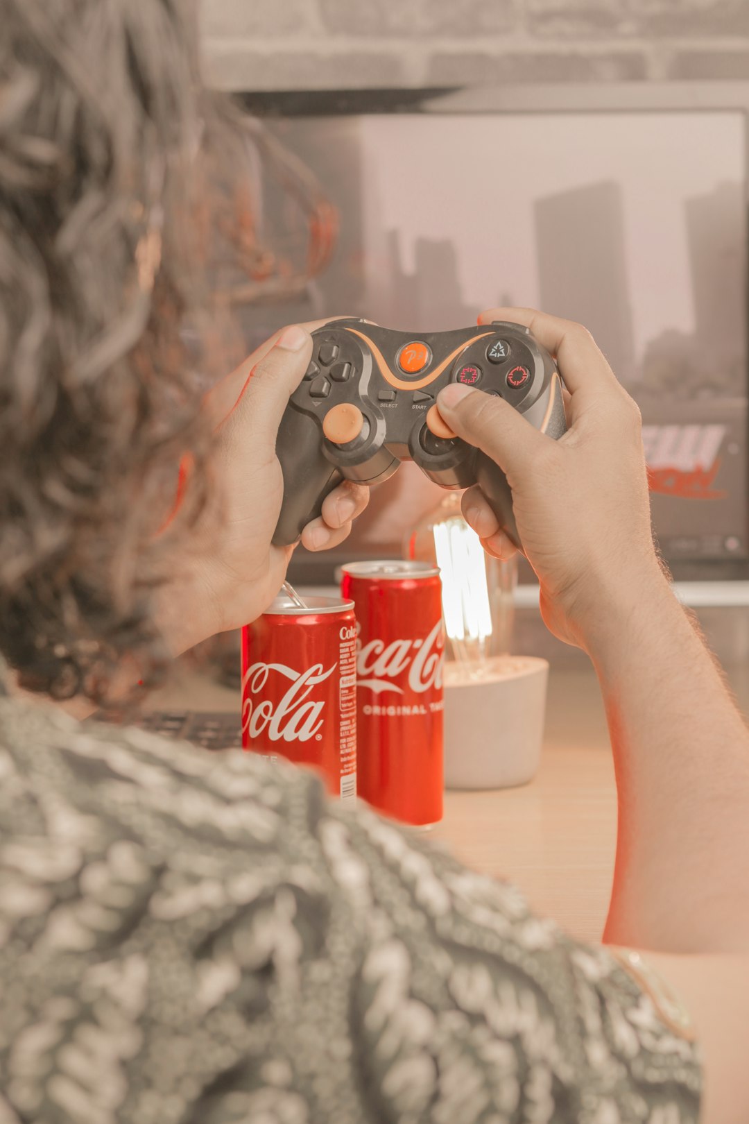 a person holding a remote control in their hand