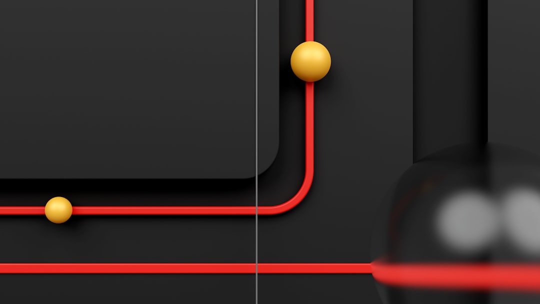 a black and red wall with some yellow balls