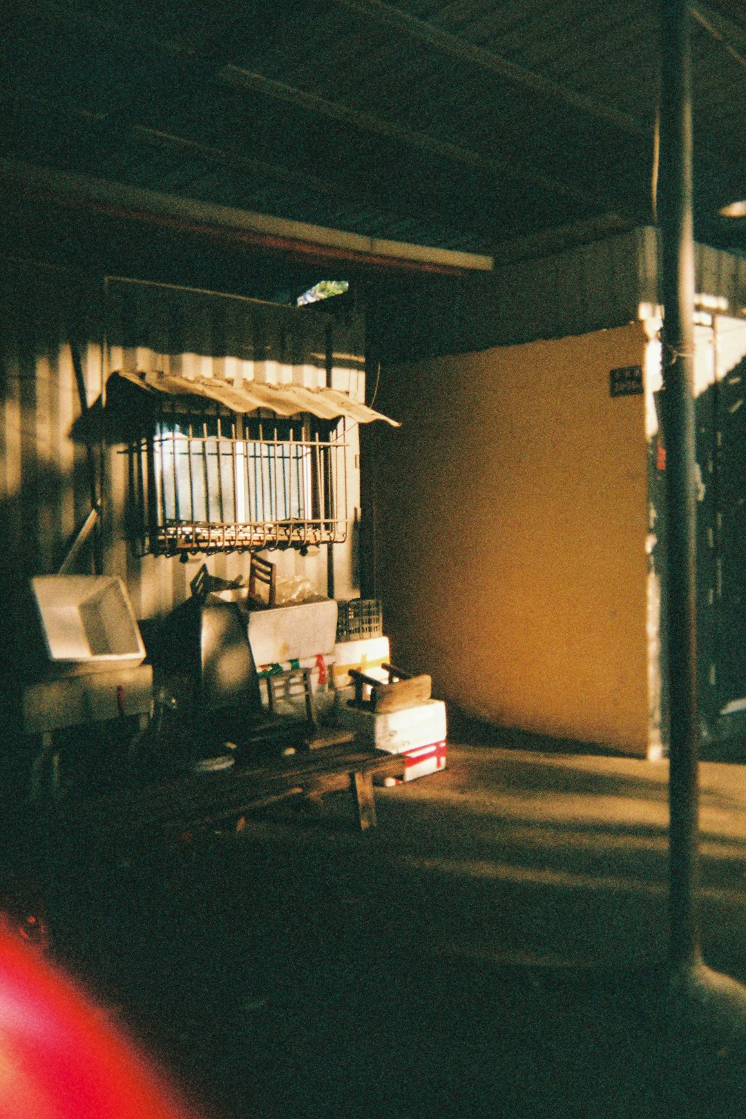 a living room filled with furniture and a window
