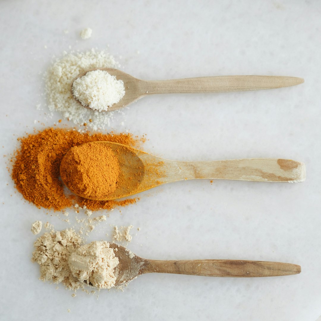 Three spoons with different types of spices on them