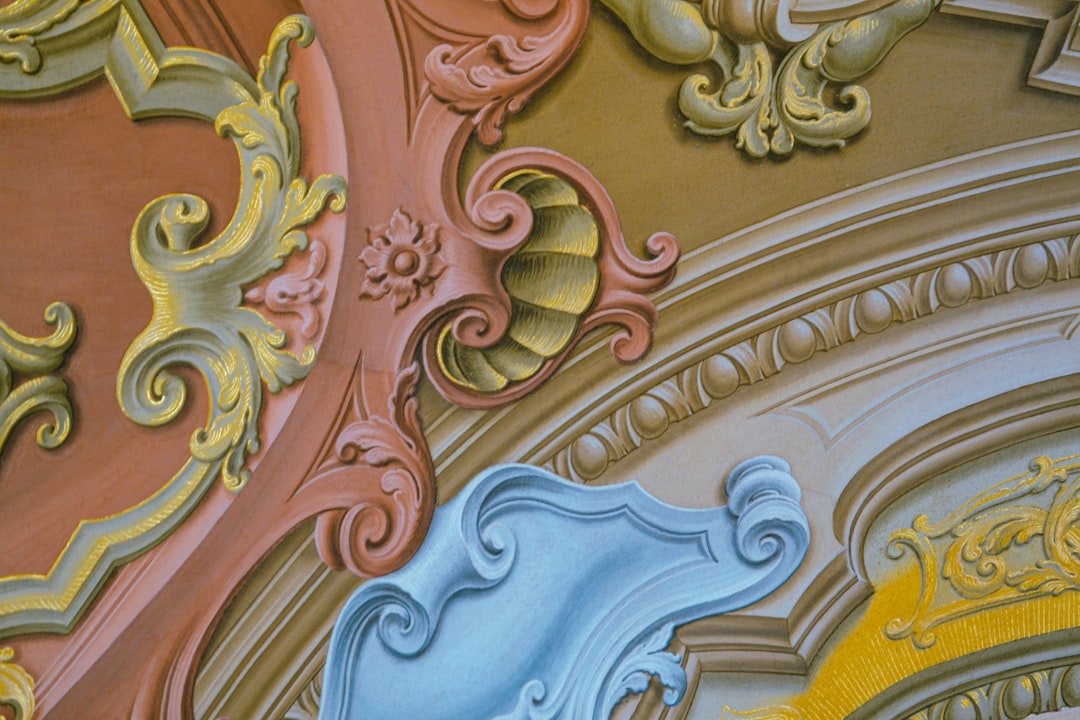 A close up of a wall with a clock on it