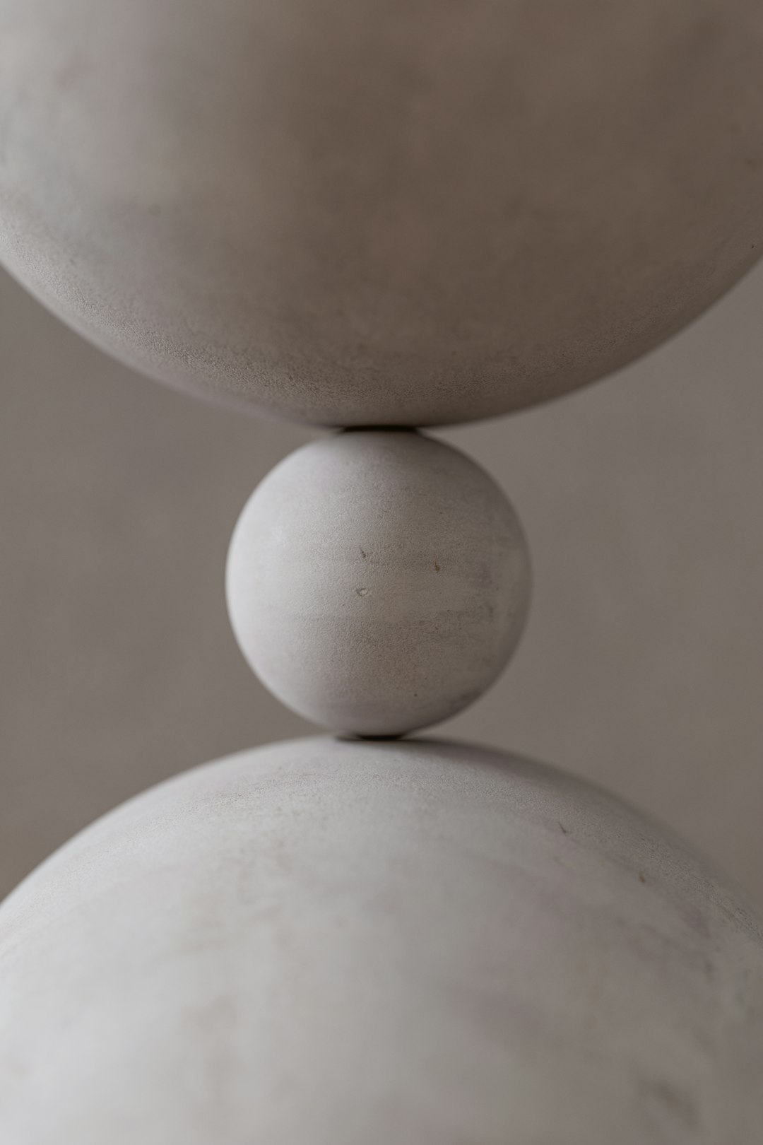 A stack of white balls sitting on top of each other