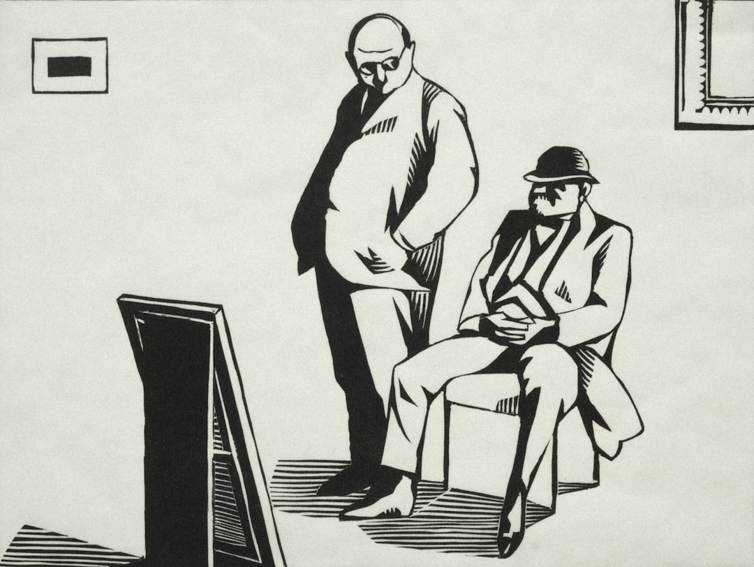 Two men observe a framed artwork in a room.