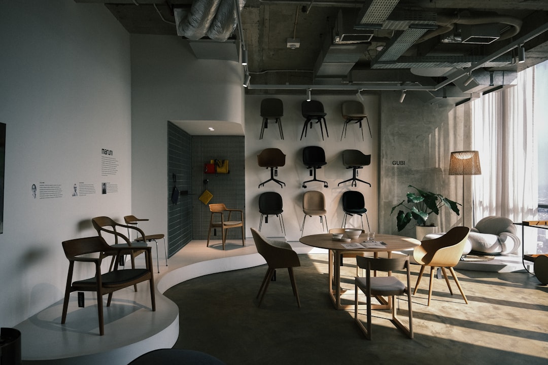A modern showroom displays various chairs and tables.