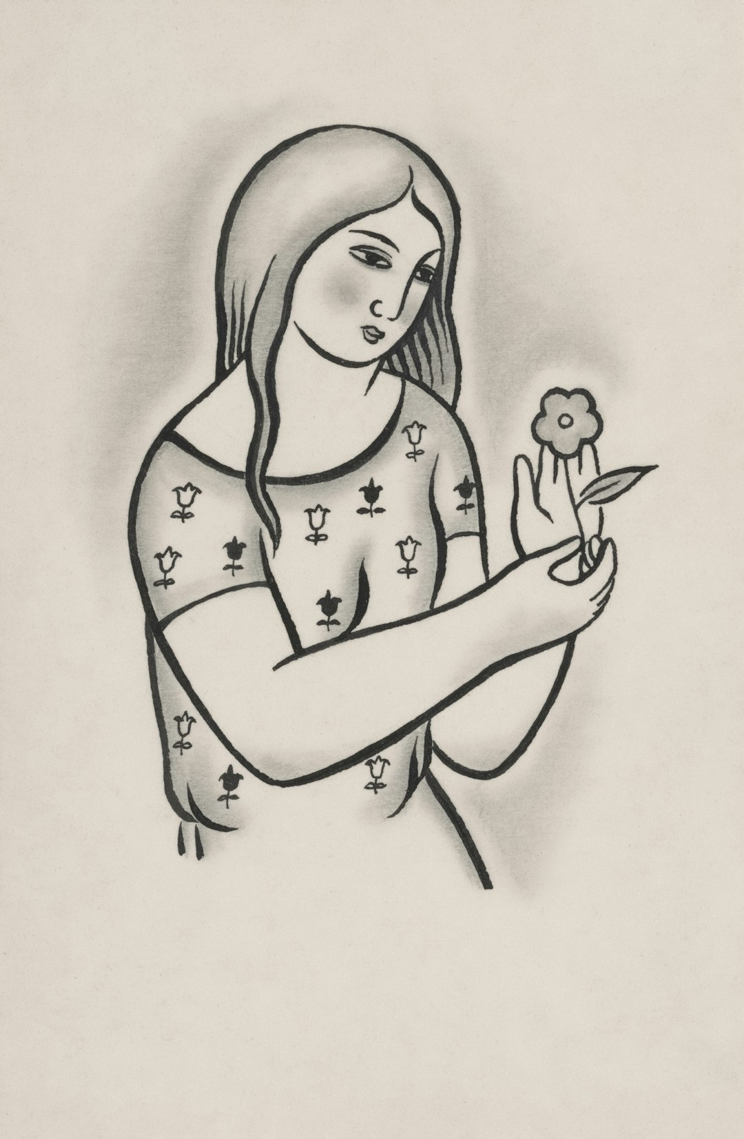 A woman holding a flower with a patterned dress.