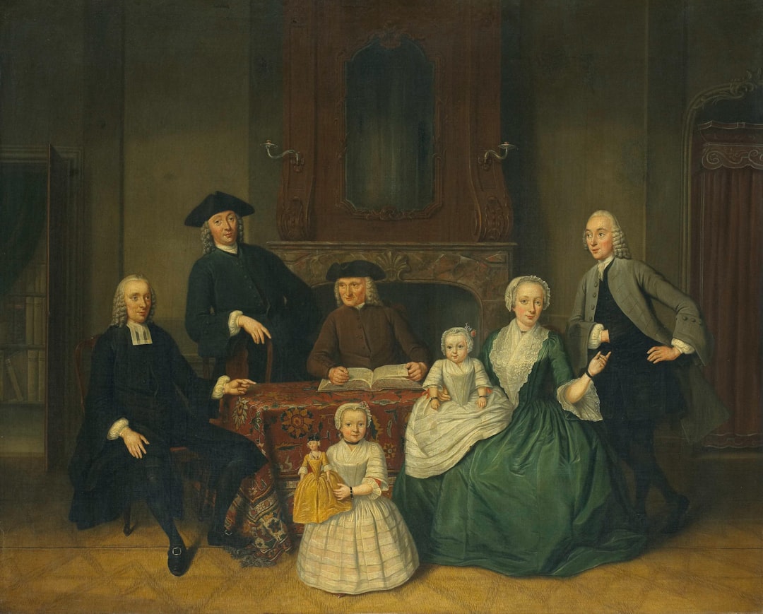 A family portrait of seven people in formal attire.