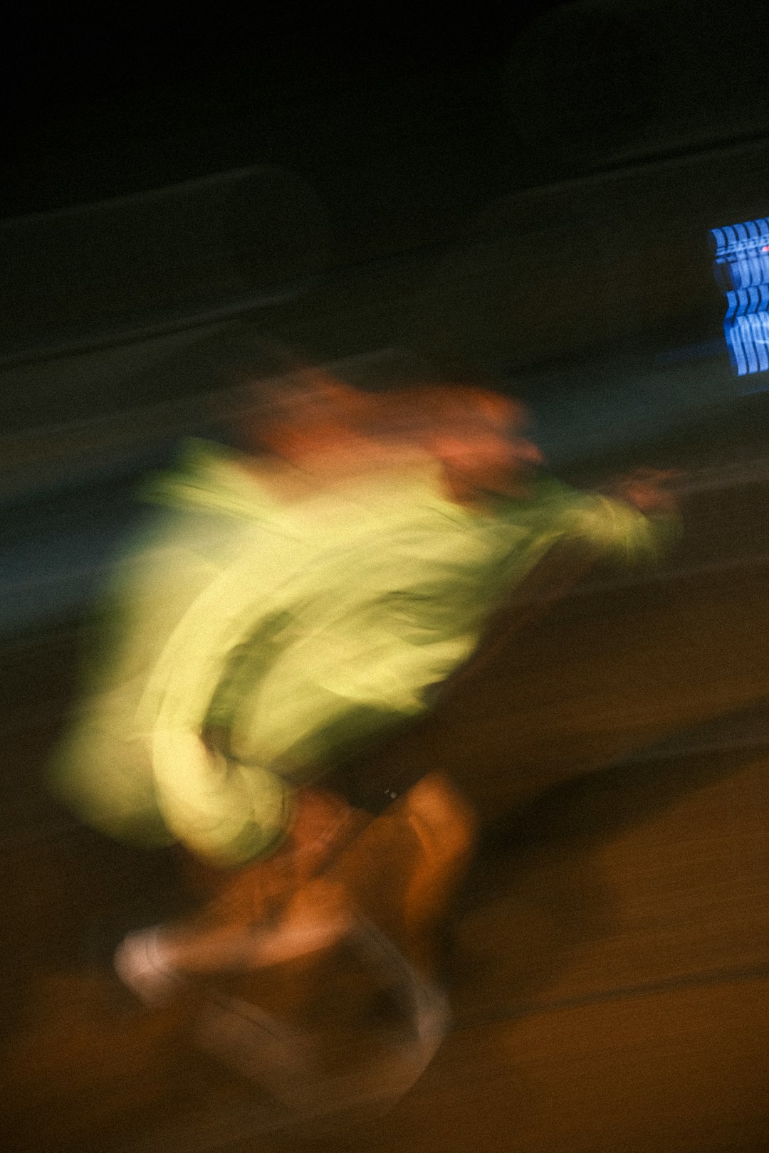 Blurred figures in motion at night