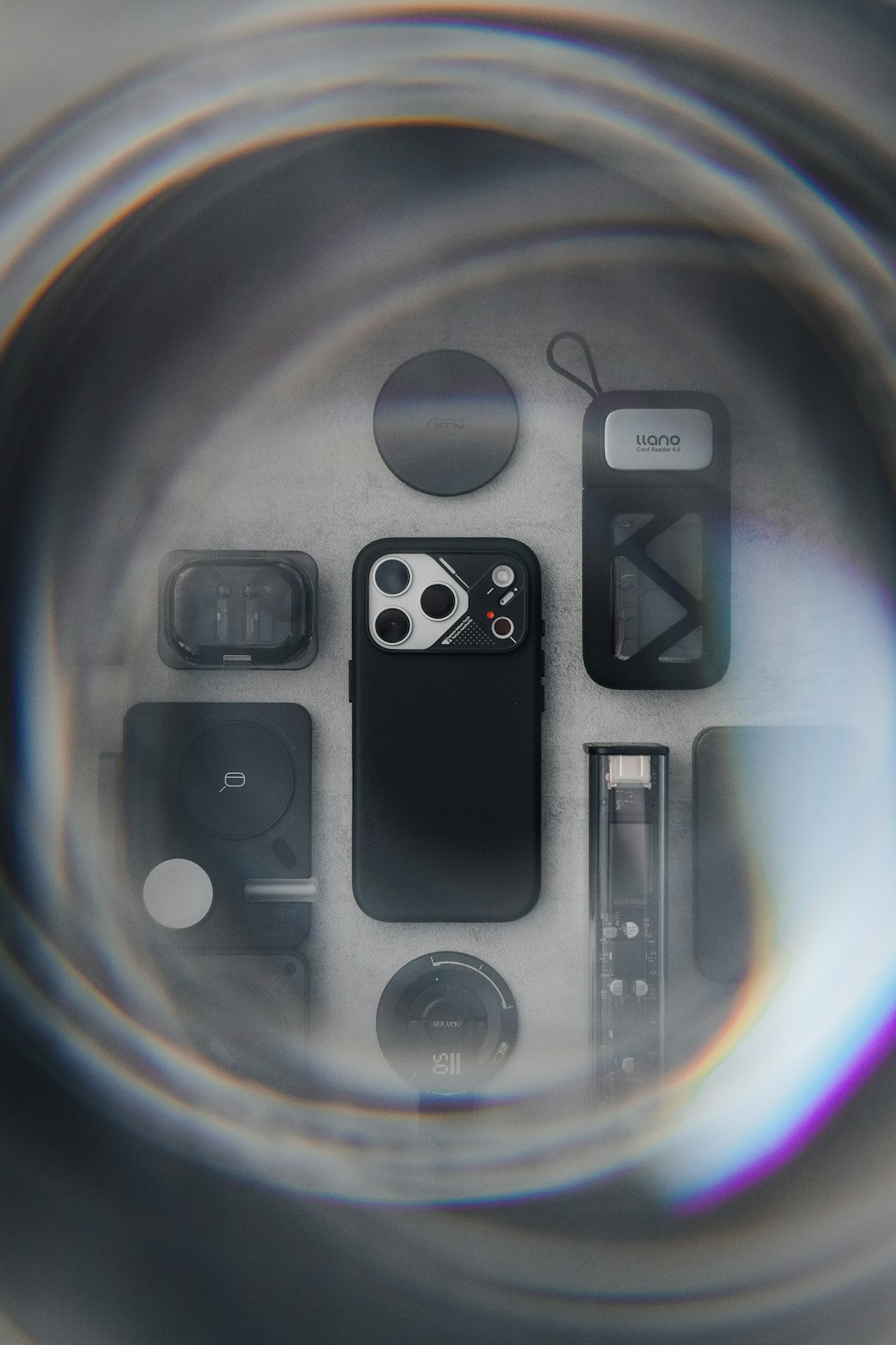 Smartphone and accessories arranged on a surface.