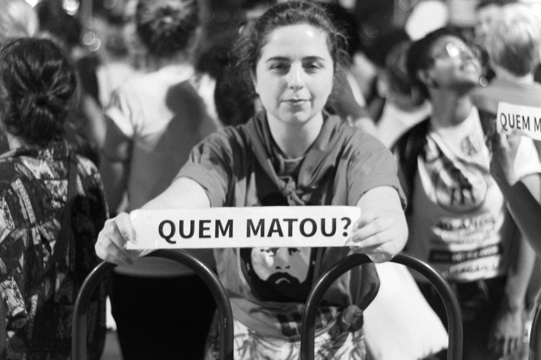 grayscale photo of woman wearing black top