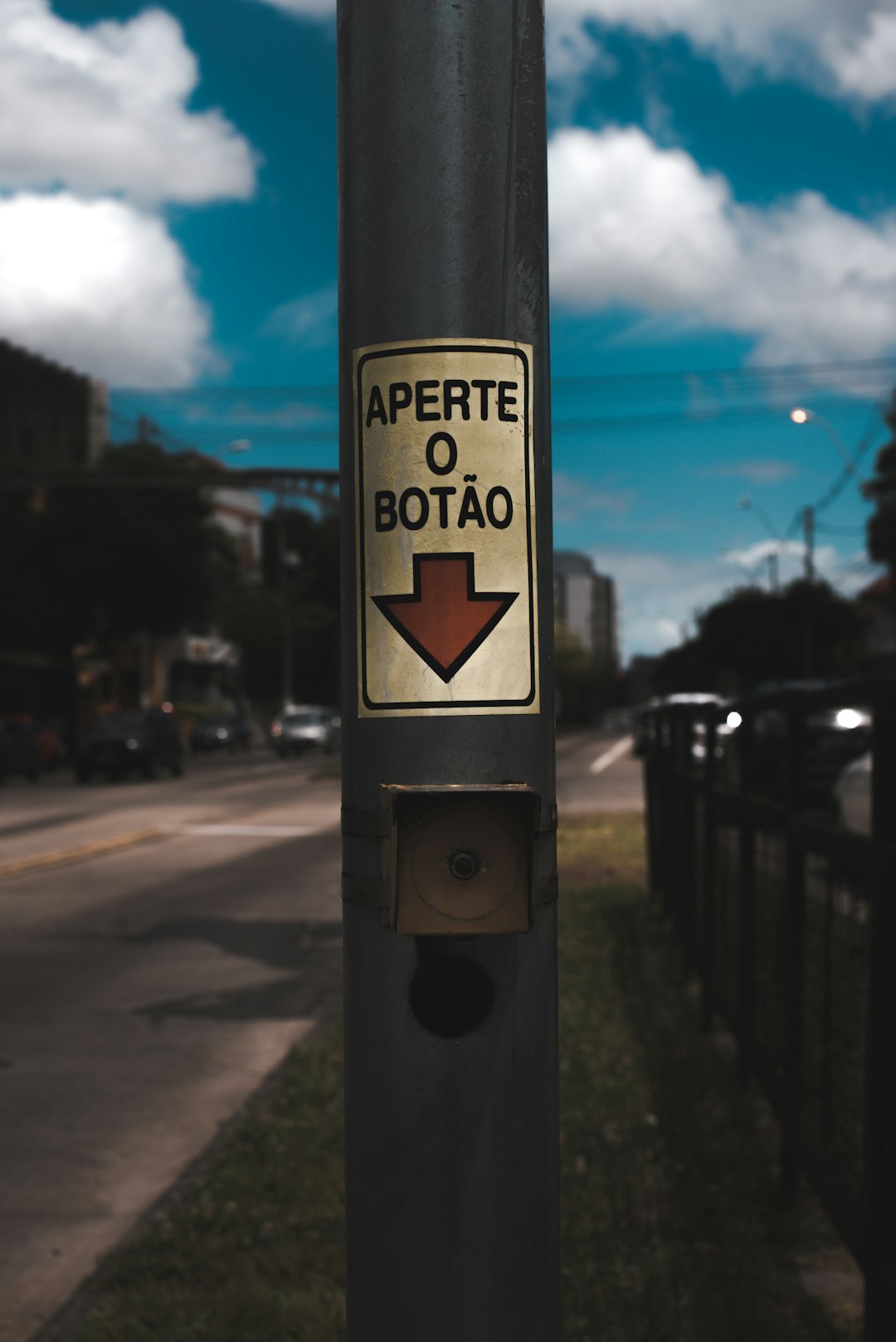 a street sign on a pole on the side of the road