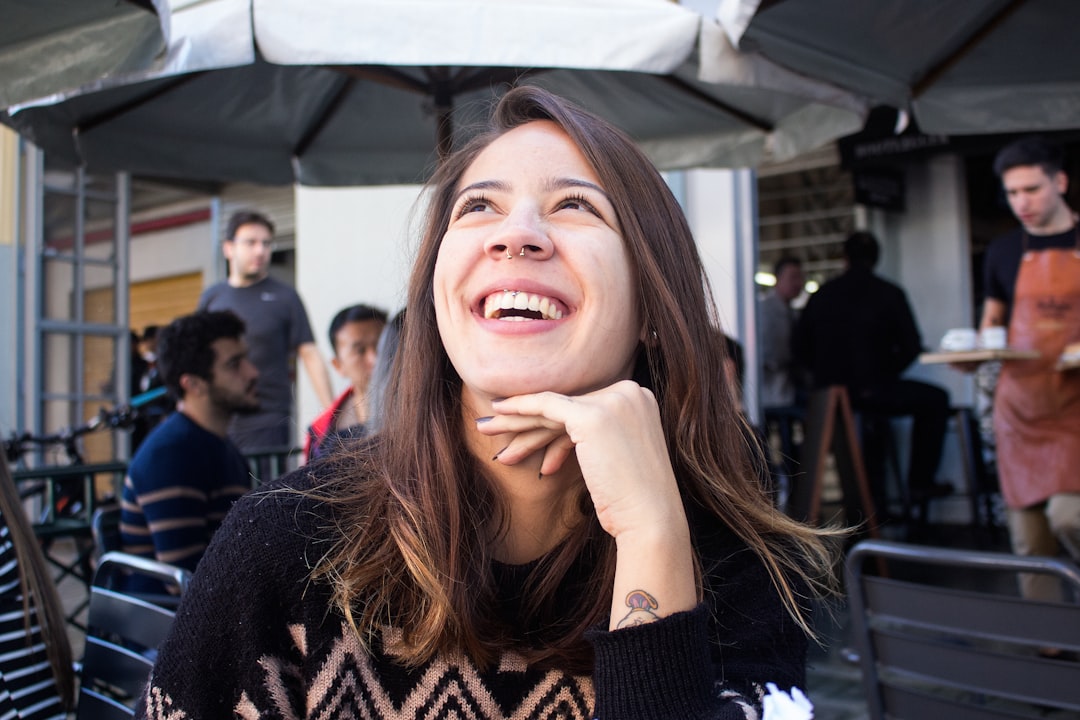 smiling woman wearing black sweater