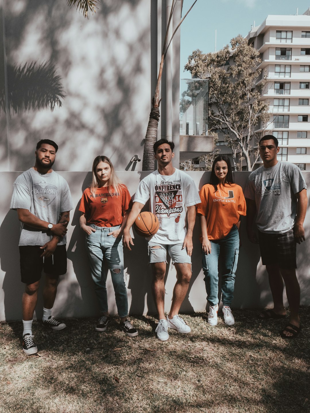 group of people standing on green grass field during daytime