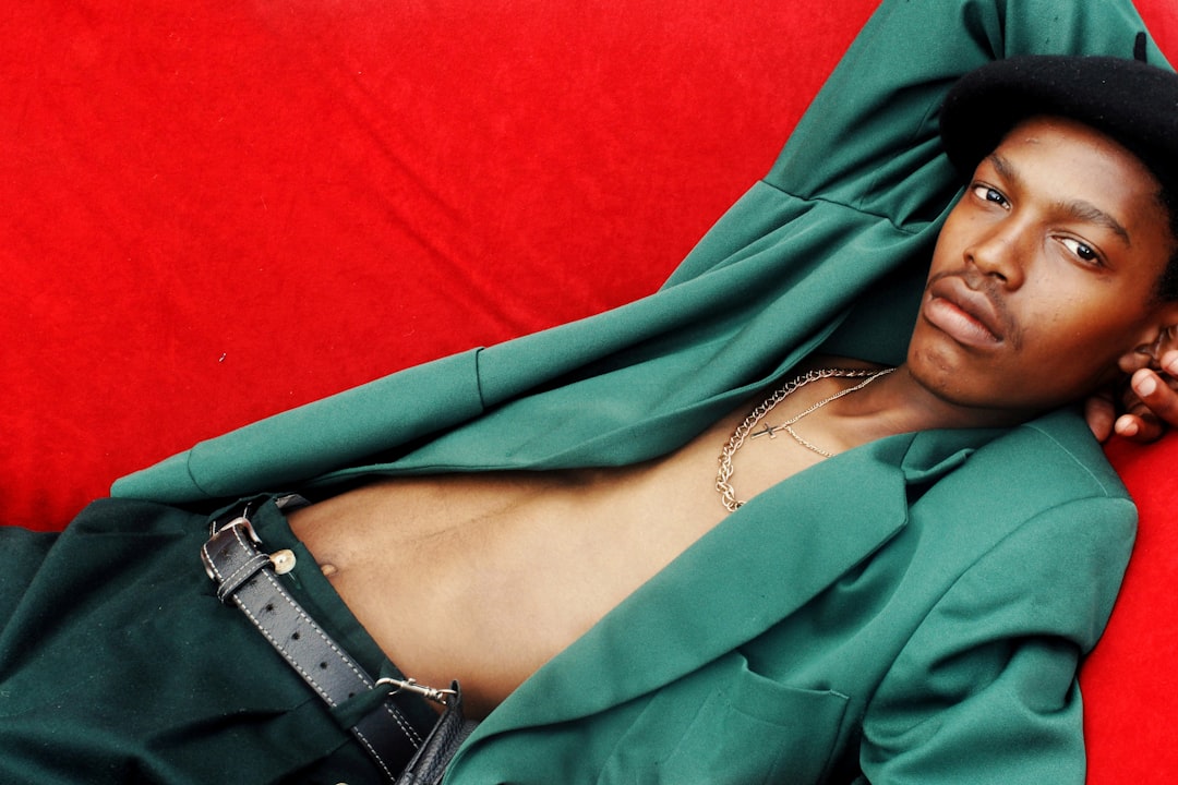 woman in green long sleeve shirt and black leather strap watch