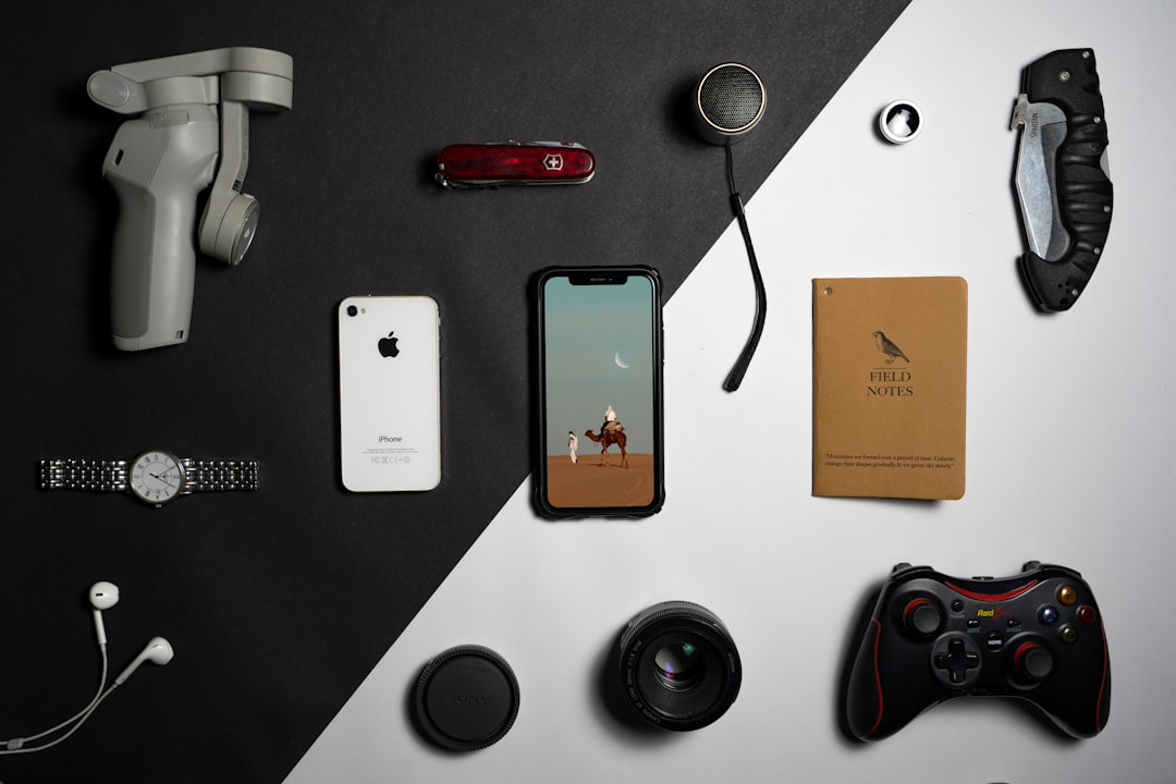 a collection of electronics and gadgets laid out on a table