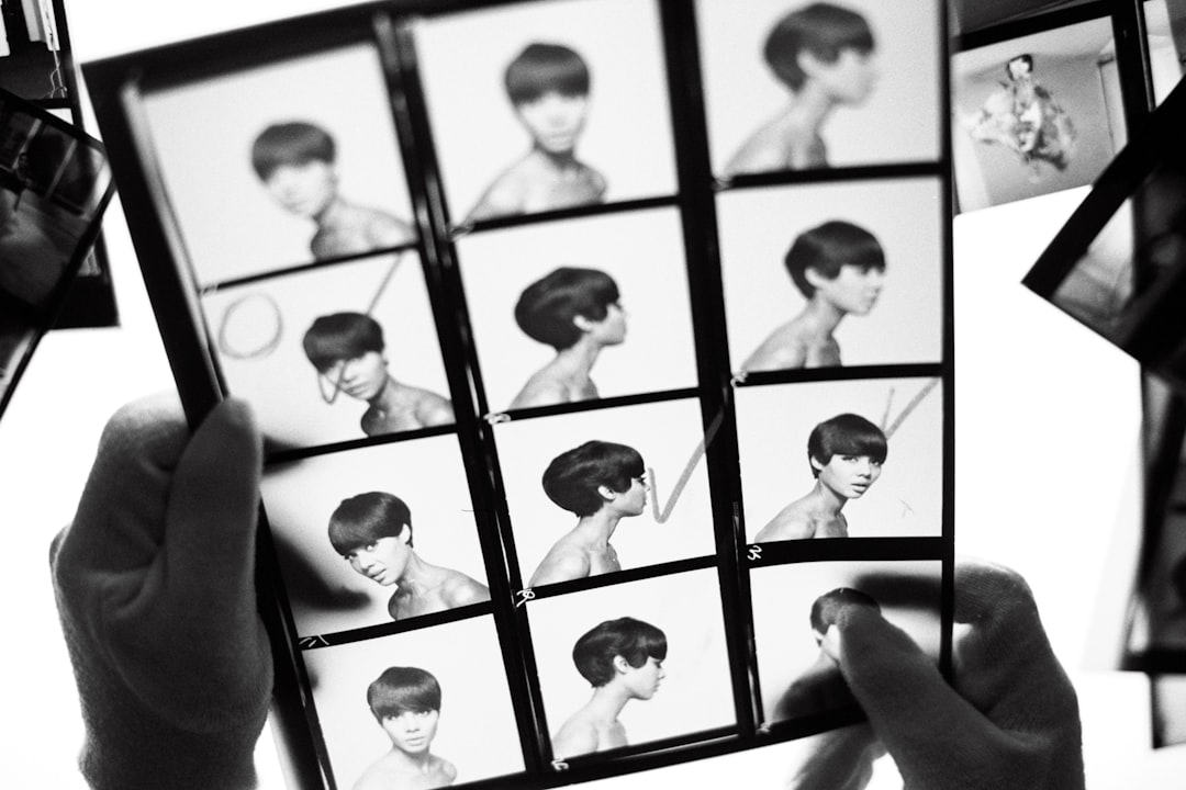 a person holding up a picture of a woman's hair