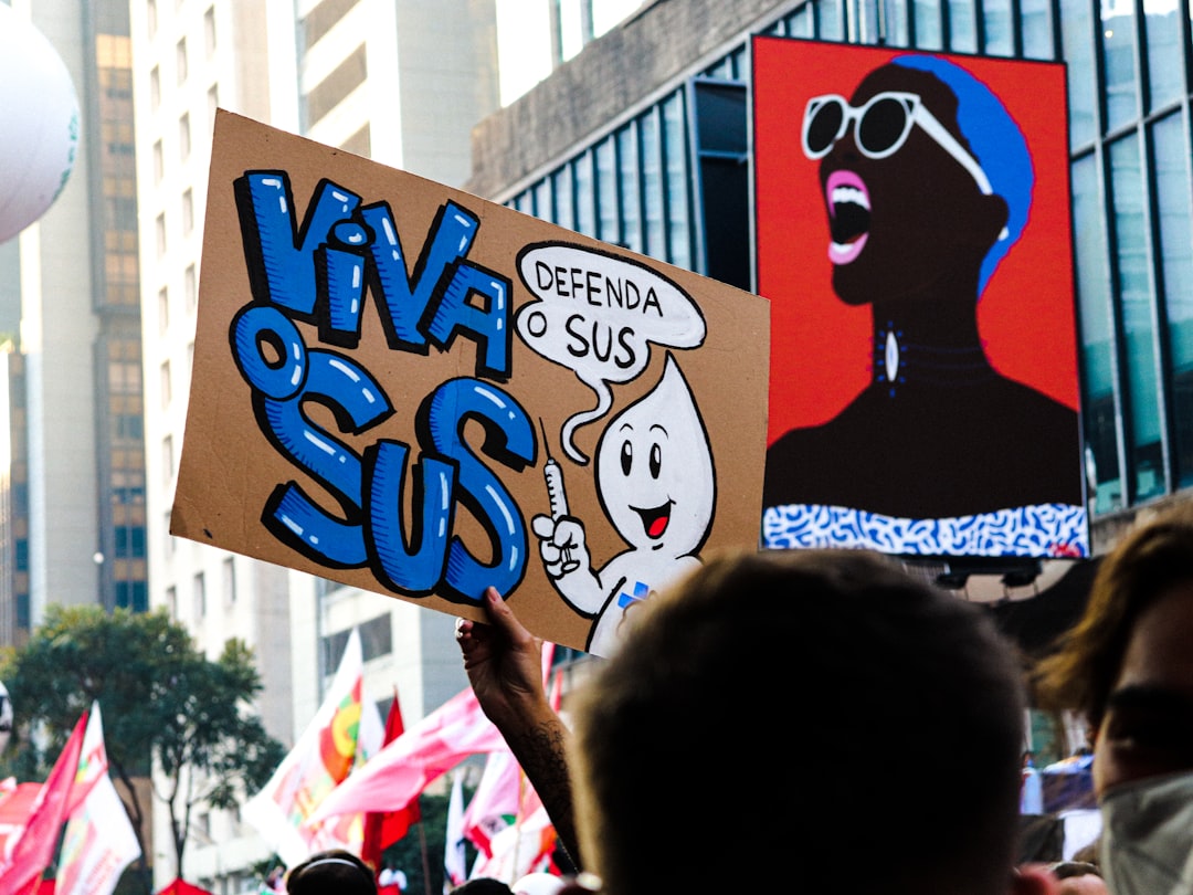 a group of people holding up signs in the air