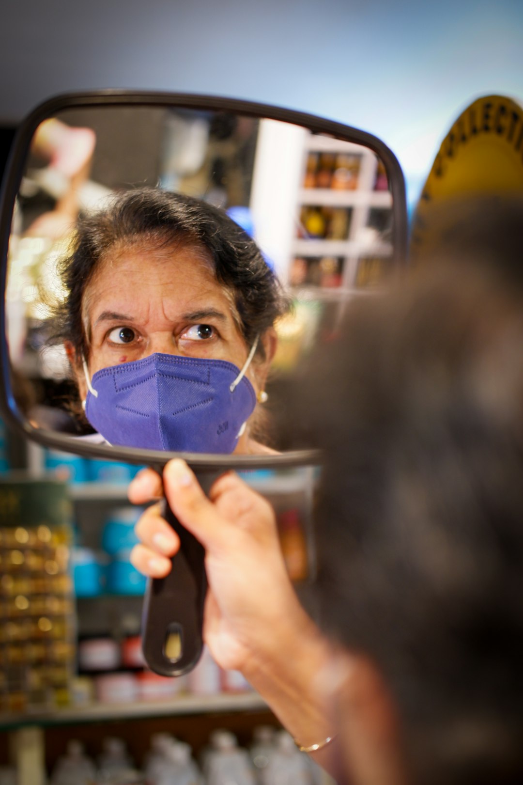 a person looking through a magnifying glass