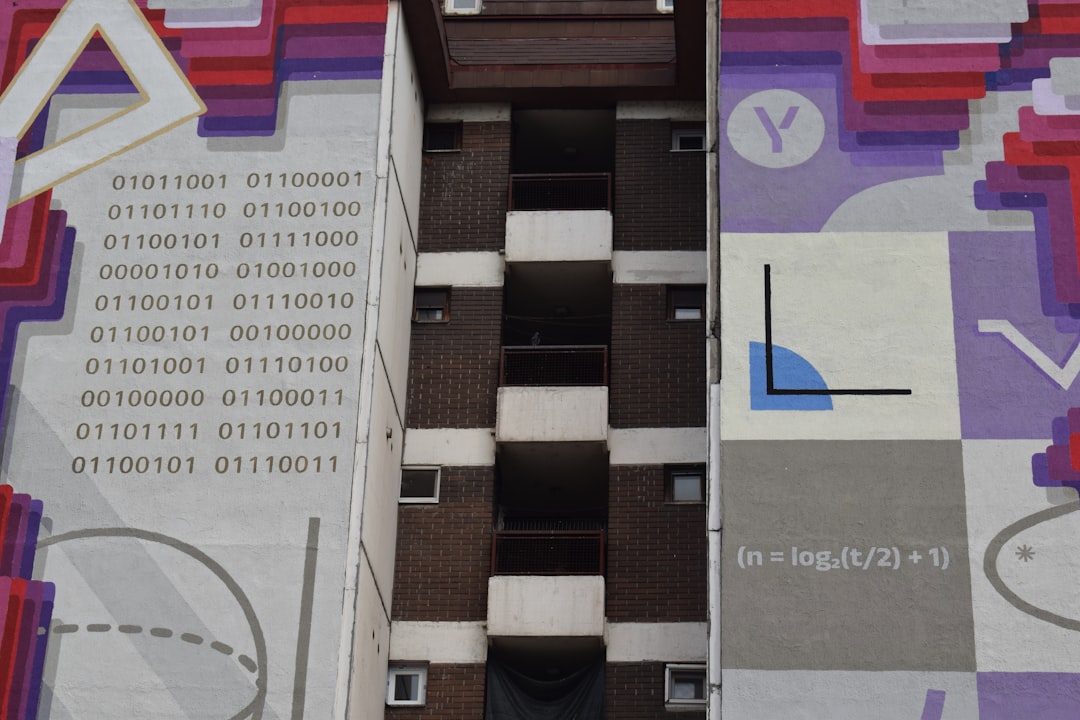 a tall building with a lot of numbers painted on it