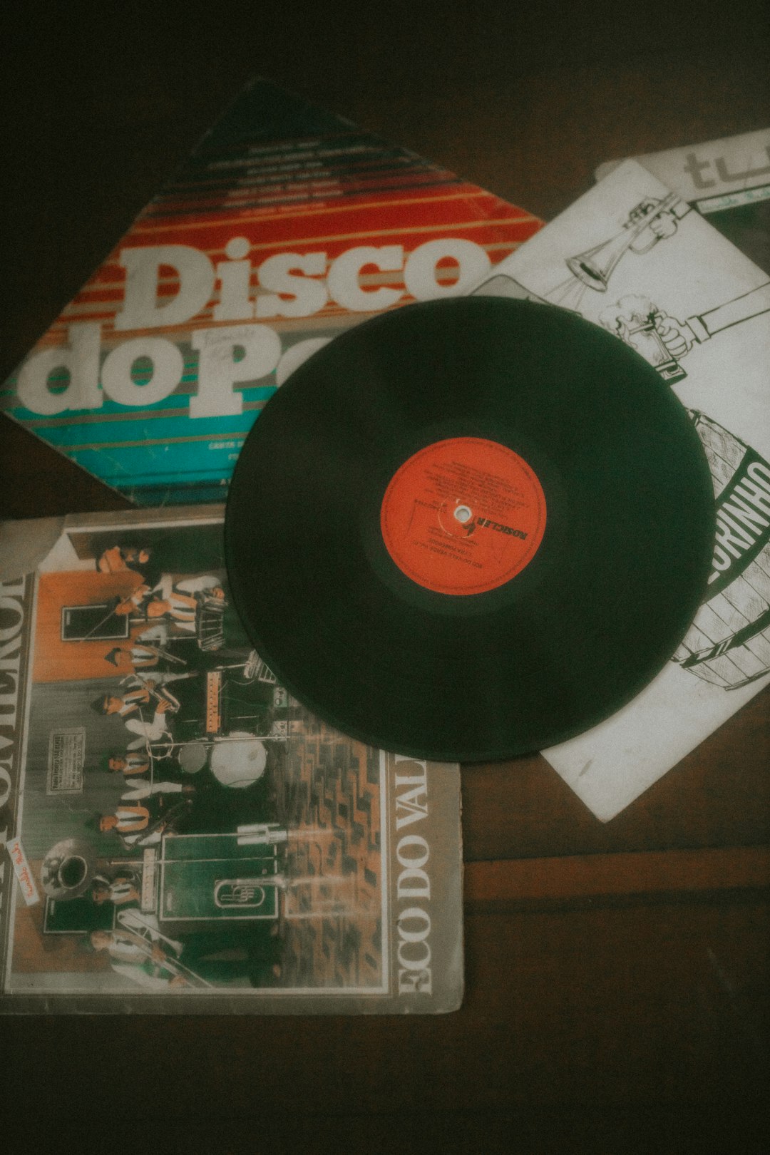 a record player's record and other items on a table