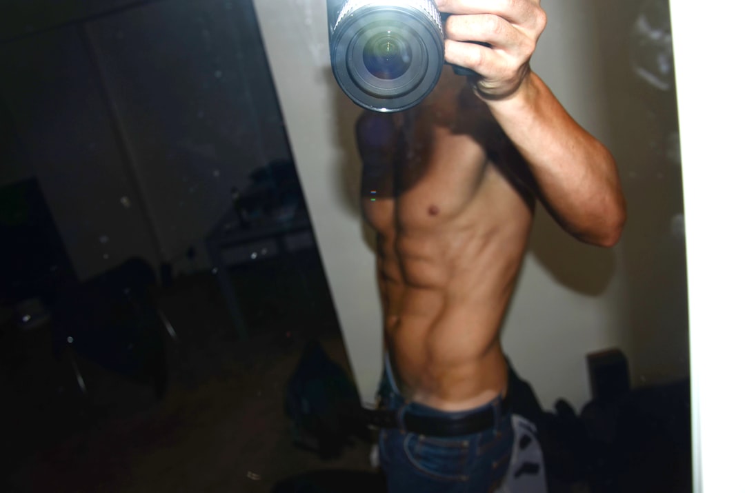 a man taking a picture of himself in a mirror