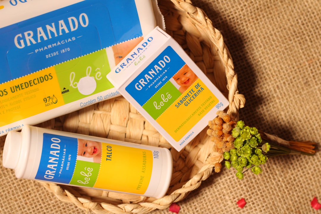 A basket with three bottles of granad on it