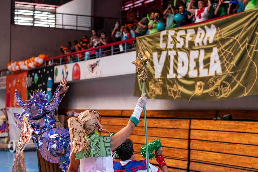 A group of people standing on top of a basketball court