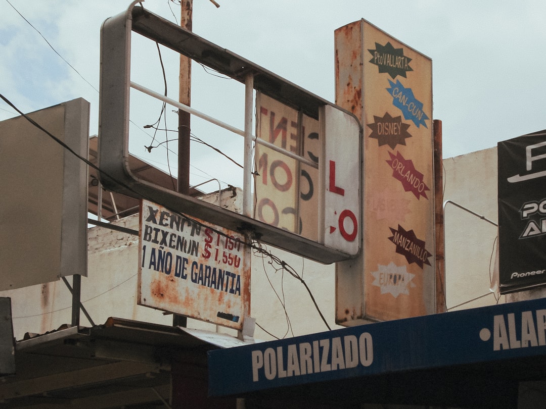 A bunch of signs that are on the side of a building