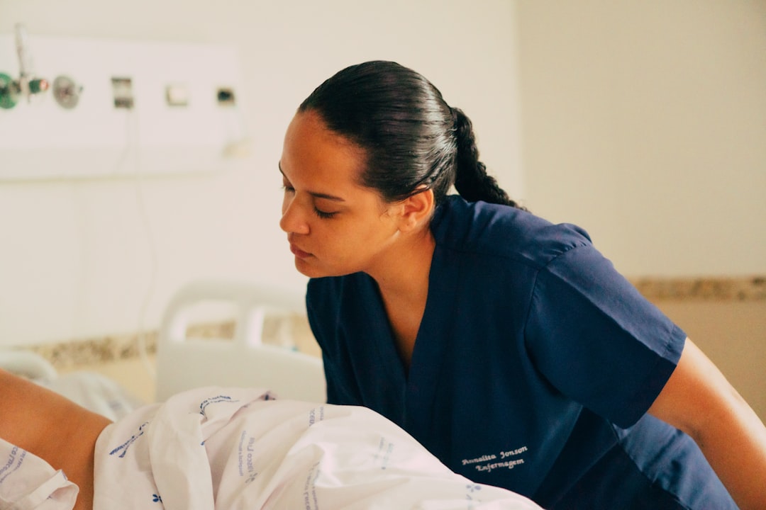 A nurse is attending to a patient in a hospital.