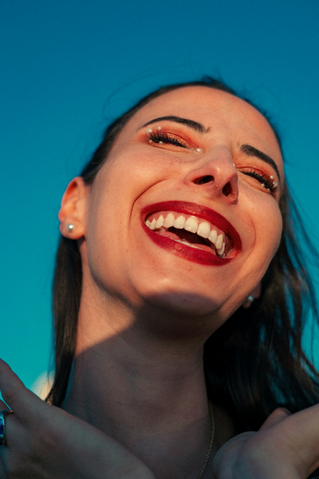 A woman laughs with great joy.