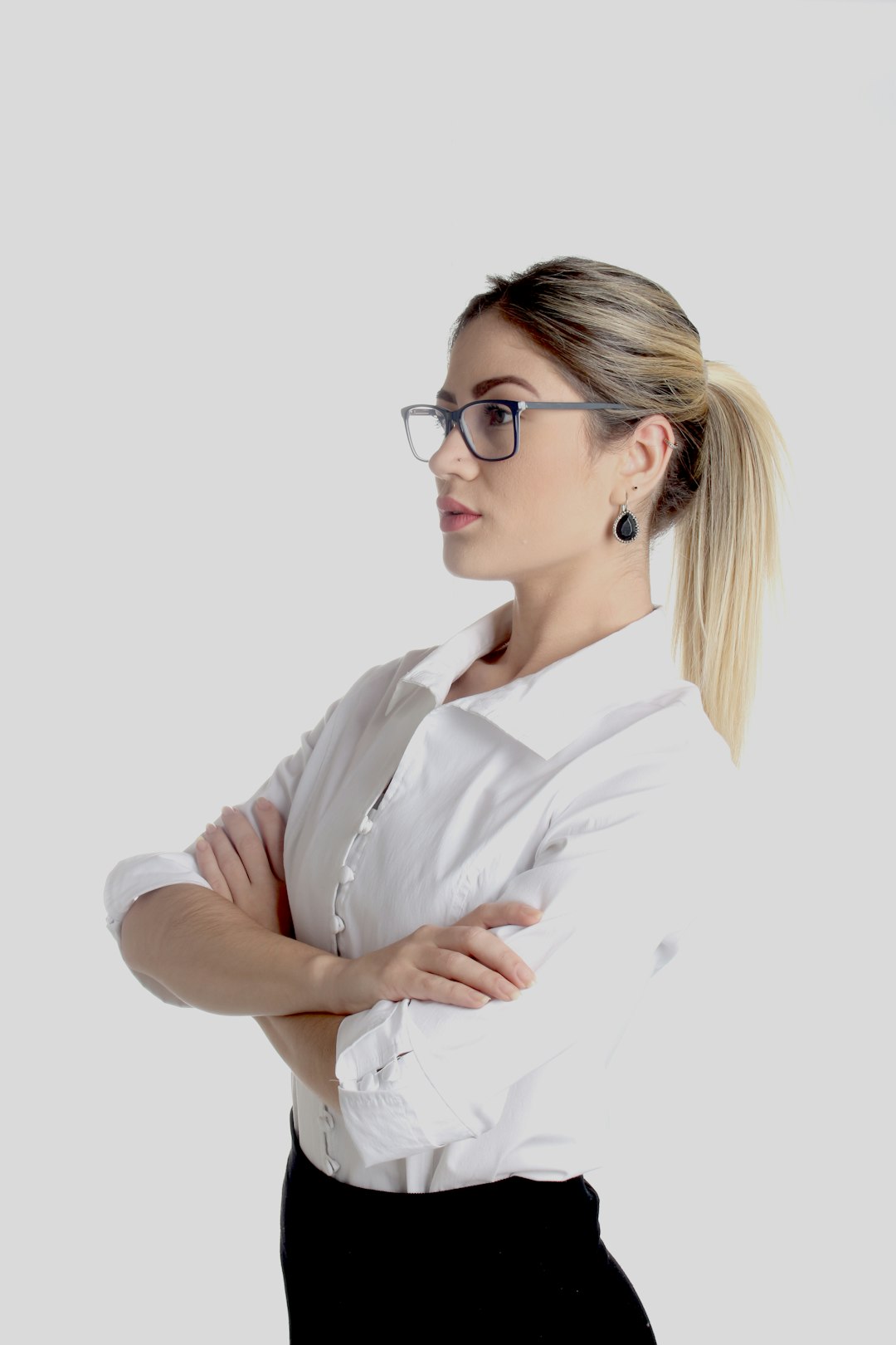 Woman in glasses with arms crossed