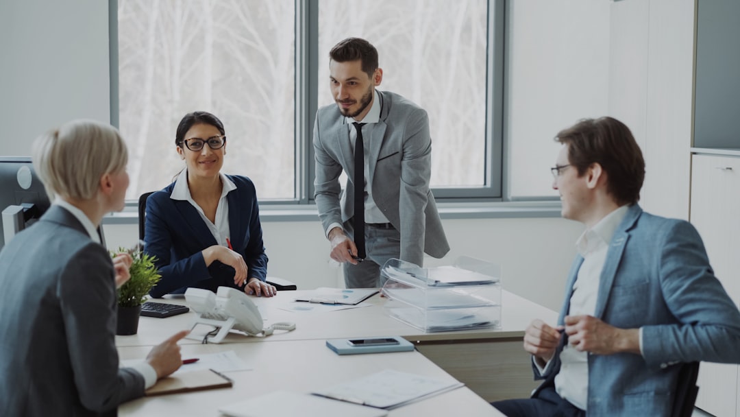Business professionals collaborating around a conference table.