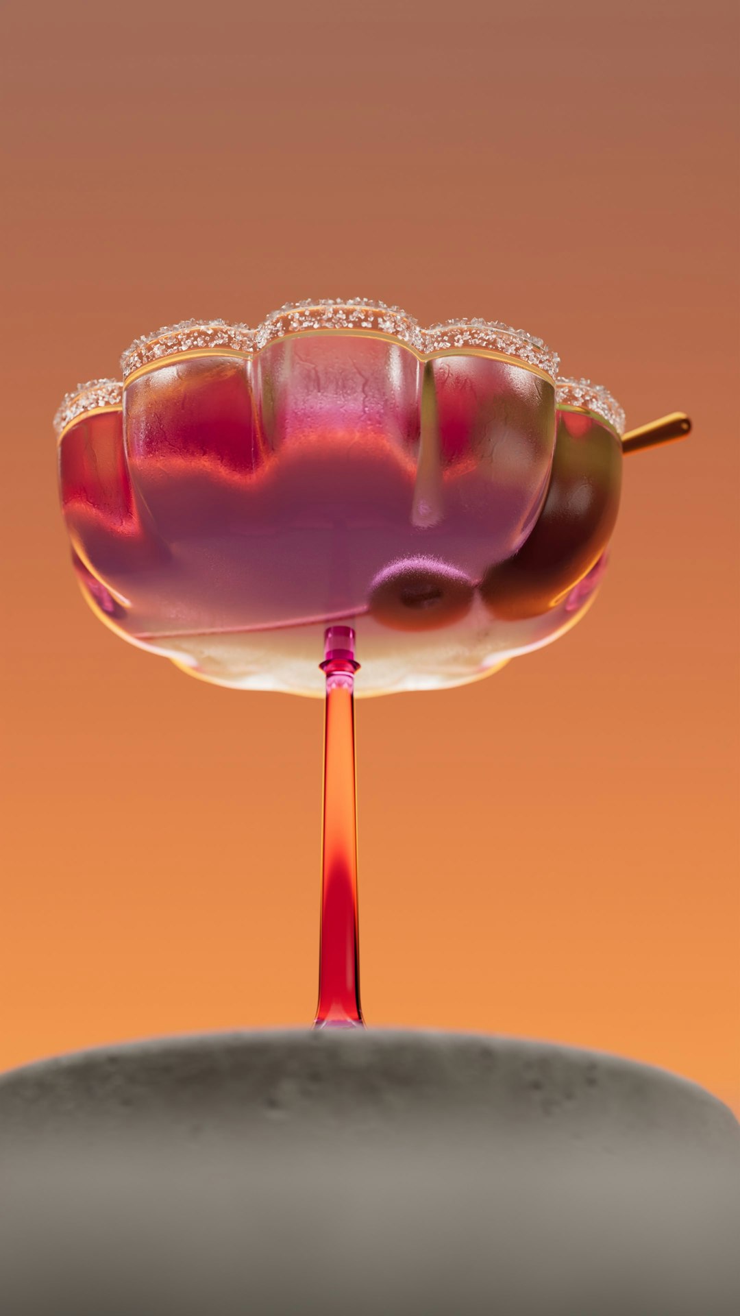 A pink liquid is poured into a flower-shaped glass.