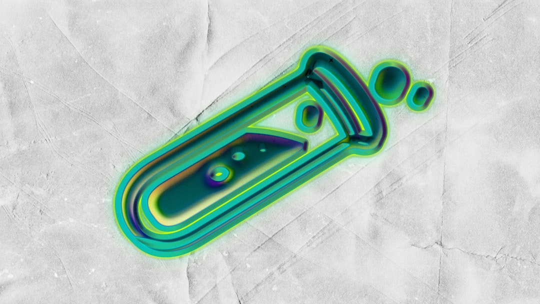 A glowing green test tube with bubbles