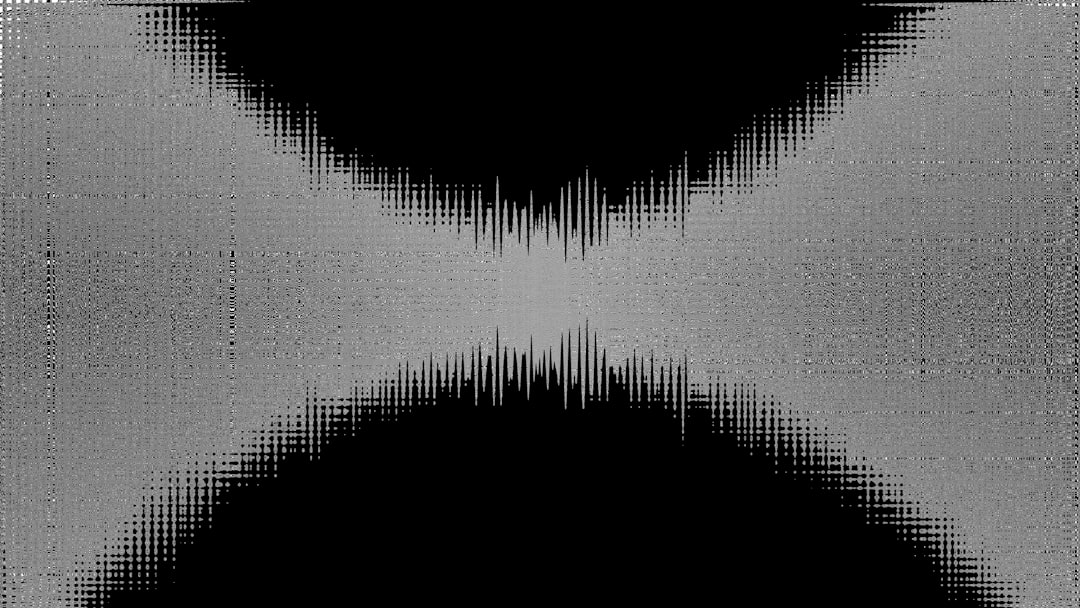 Abstract grayscale waveform with dark background