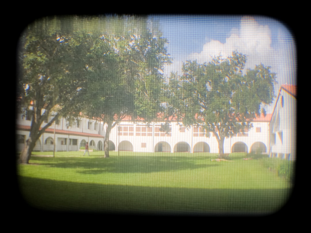 Courtyard with arched walkway and trees