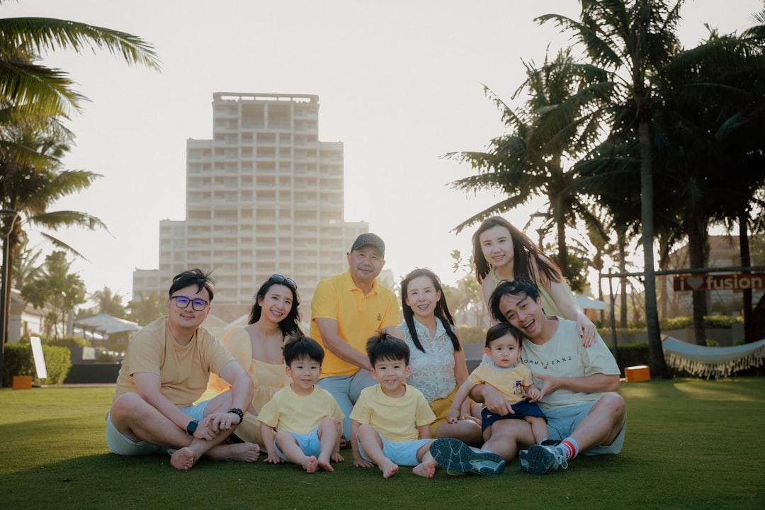 A multi-generational family poses for a photo outside.