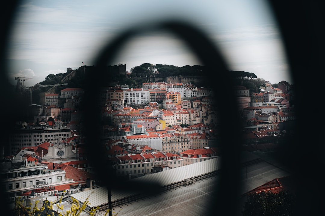 View of a european city through a dark, blurry foreground.