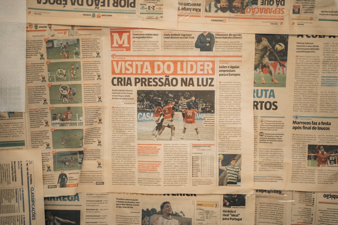 Newspaper headlines and articles displayed on a wall.